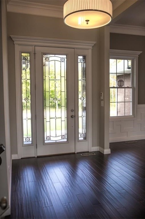 Large traditional foyer in Indianapolis with grey walls, dark hardwood floors, a single front door and a white front door.