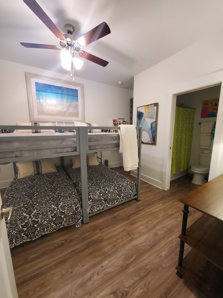 Bedroom - mid-sized transitional guest vinyl floor and beige floor bedroom idea with white walls