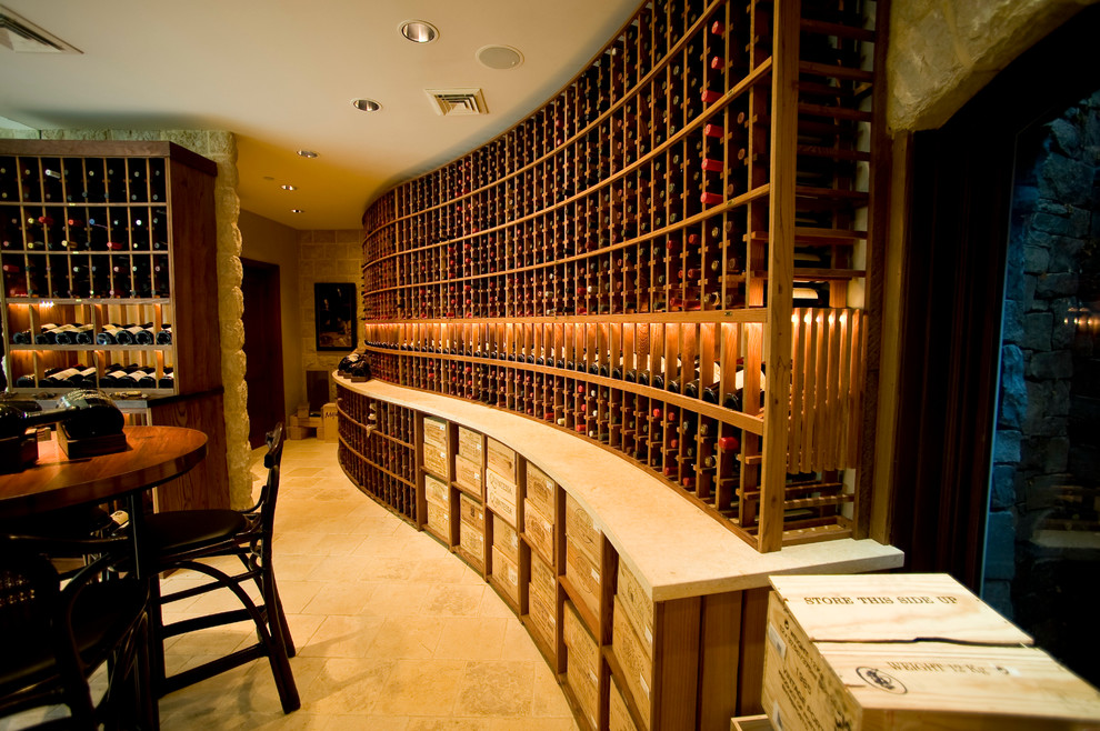 Inspiration for a large modern wine cellar in San Francisco with travertine floors, storage racks and yellow floor.