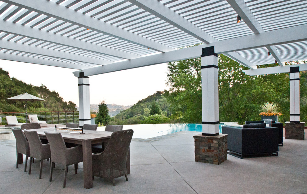 Photo of a contemporary backyard patio in San Francisco with concrete slab and a pergola.