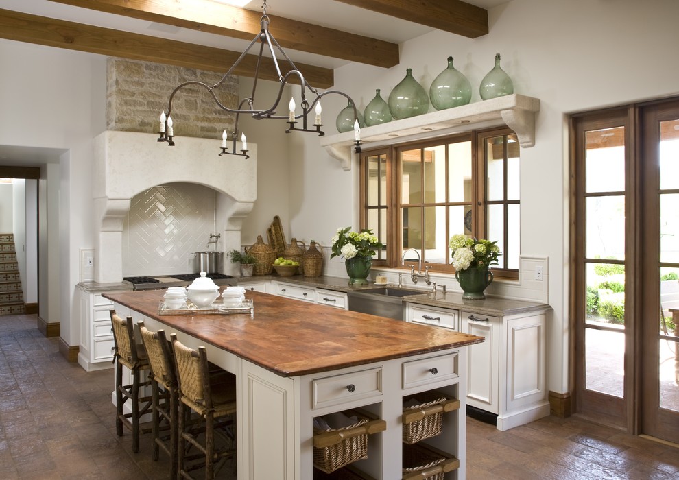 Inspiration for a traditional kitchen in Phoenix with a farmhouse sink and wood benchtops.
