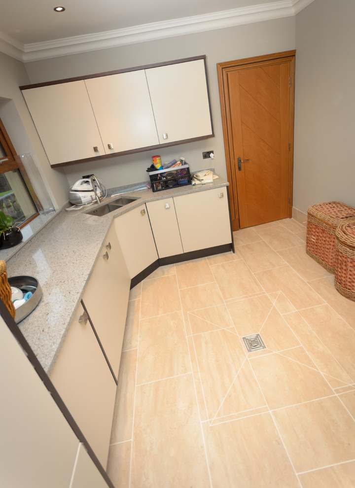 This is an example of a contemporary laundry room in Manchester.