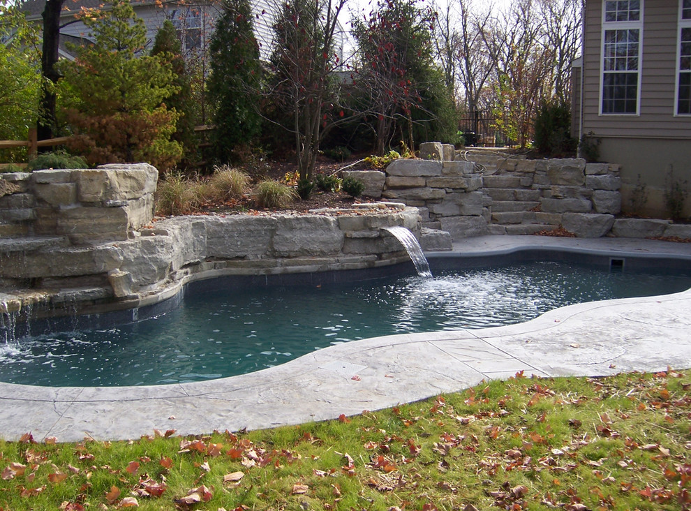 Example of a large backyard stone and custom-shaped natural pool fountain design in Cincinnati