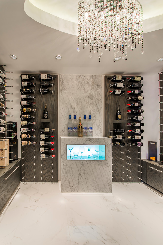 Design ideas for a contemporary wine cellar in Vancouver with display racks and marble floors.
