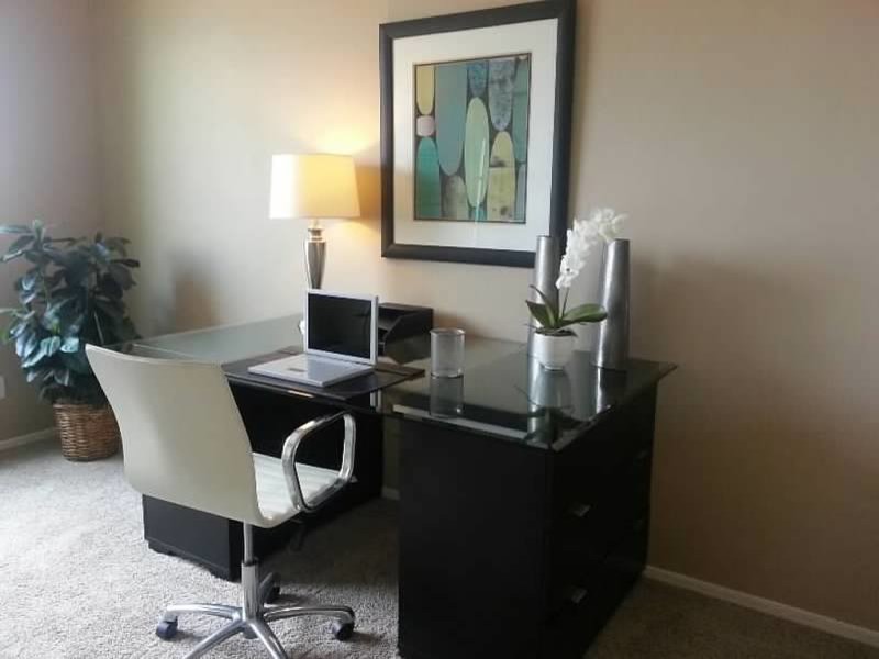 Inspiration for a mid-sized modern freestanding desk carpeted and beige floor study room remodel in Phoenix with beige walls and no fireplace