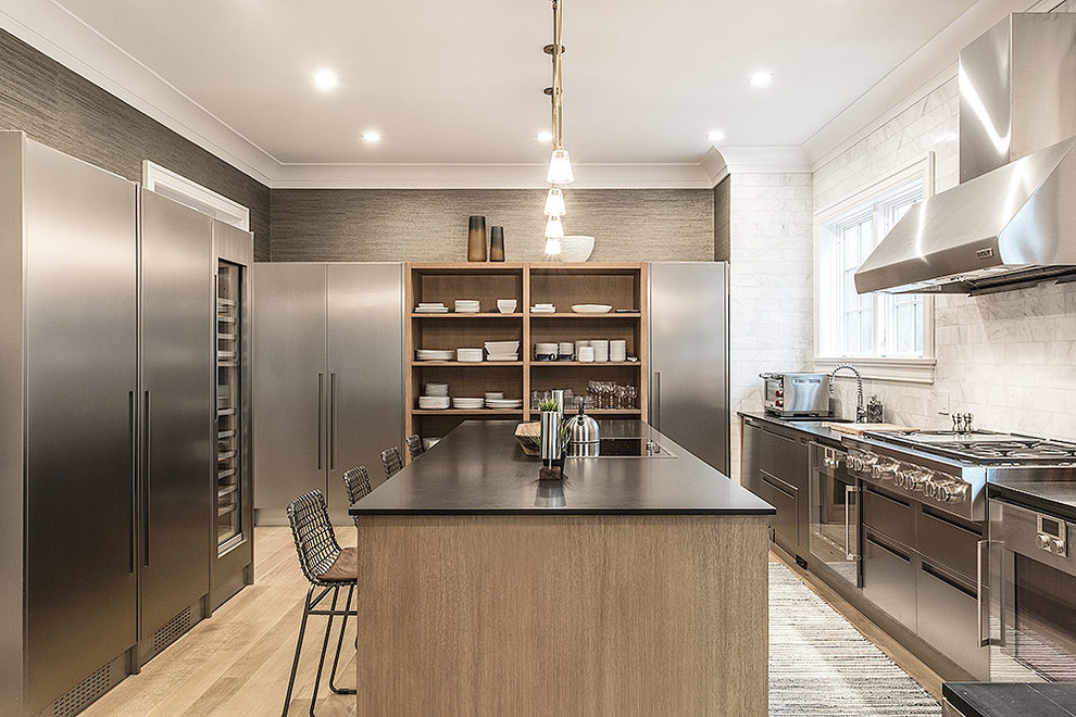 Inspiration for a contemporary separate kitchen in New York with an undermount sink, open cabinets, white splashback, stainless steel appliances, light hardwood floors and with island.