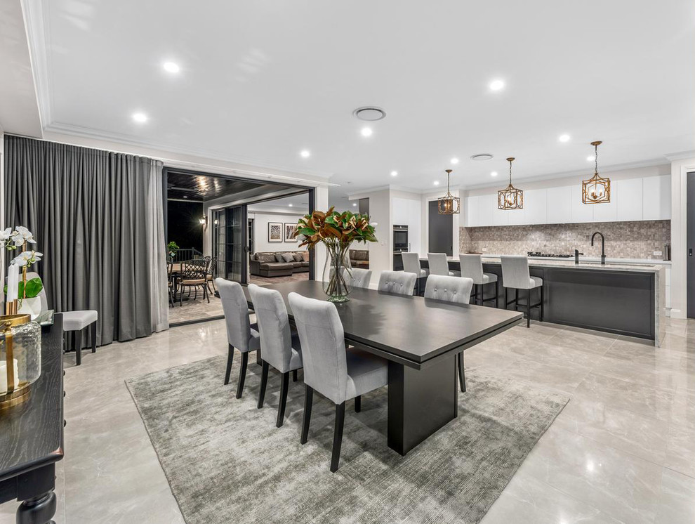 Design ideas for an expansive traditional kitchen/dining combo in Brisbane with beige walls and beige floor.