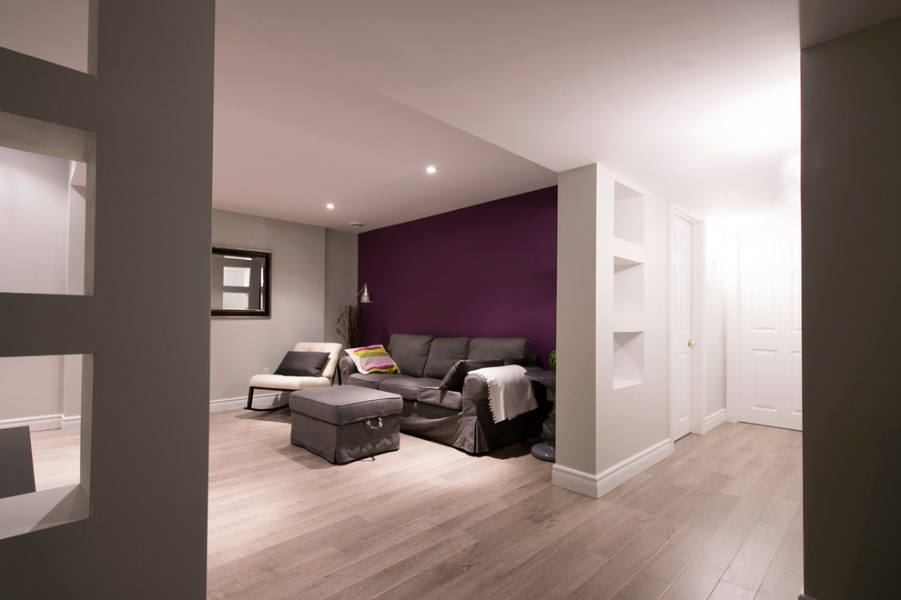 Inspiration for a mid-sized modern basement in Other with purple walls, no fireplace and beige floor.