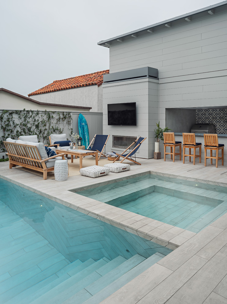 Inspiration for a beach style rectangular pool in Los Angeles with a hot tub and tile.