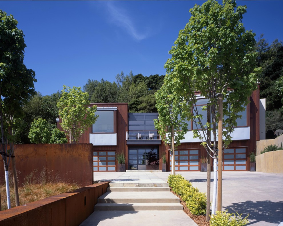 Photo of a contemporary two-storey exterior in San Francisco with wood siding.