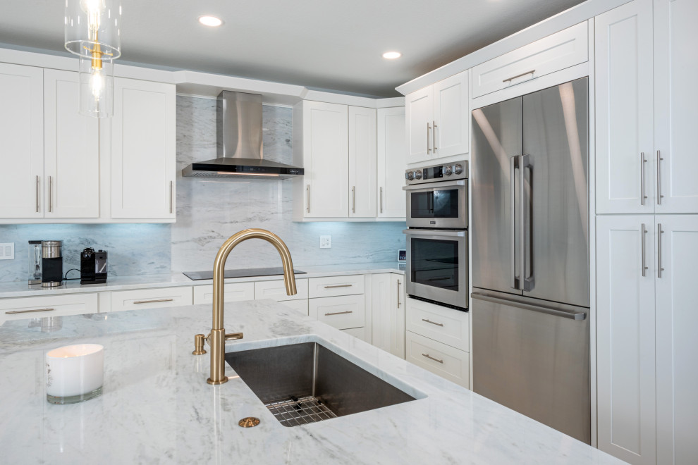 Eat-in kitchen - large contemporary l-shaped porcelain tile and white floor eat-in kitchen idea in Miami with a single-bowl sink, shaker cabinets, blue cabinets, quartzite countertops, white backsplash, marble backsplash, stainless steel appliances, an island and white countertops