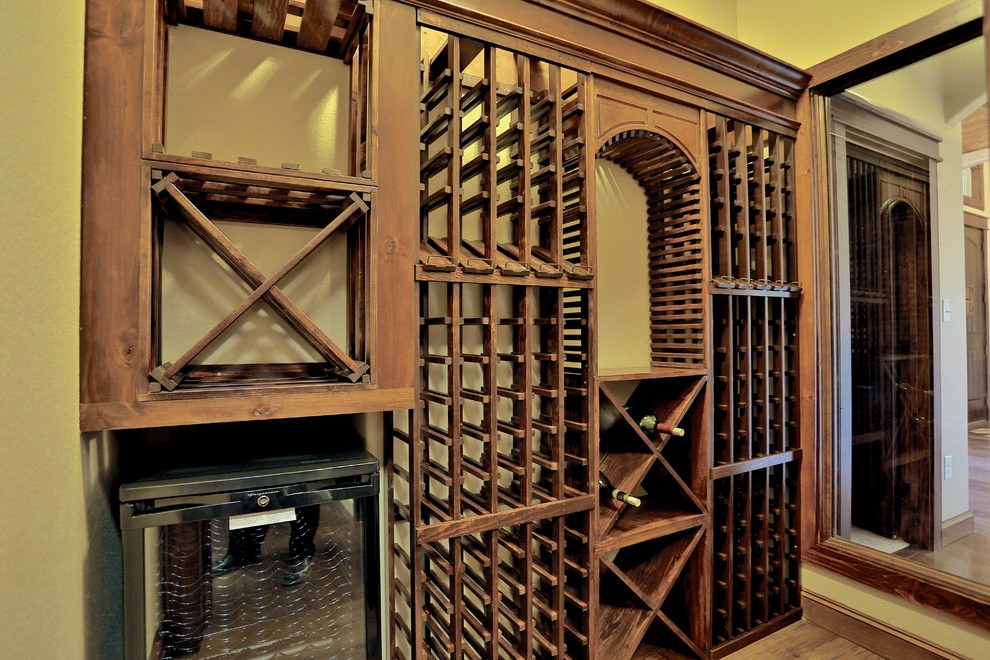 This is an example of a small mediterranean wine cellar in Dallas.