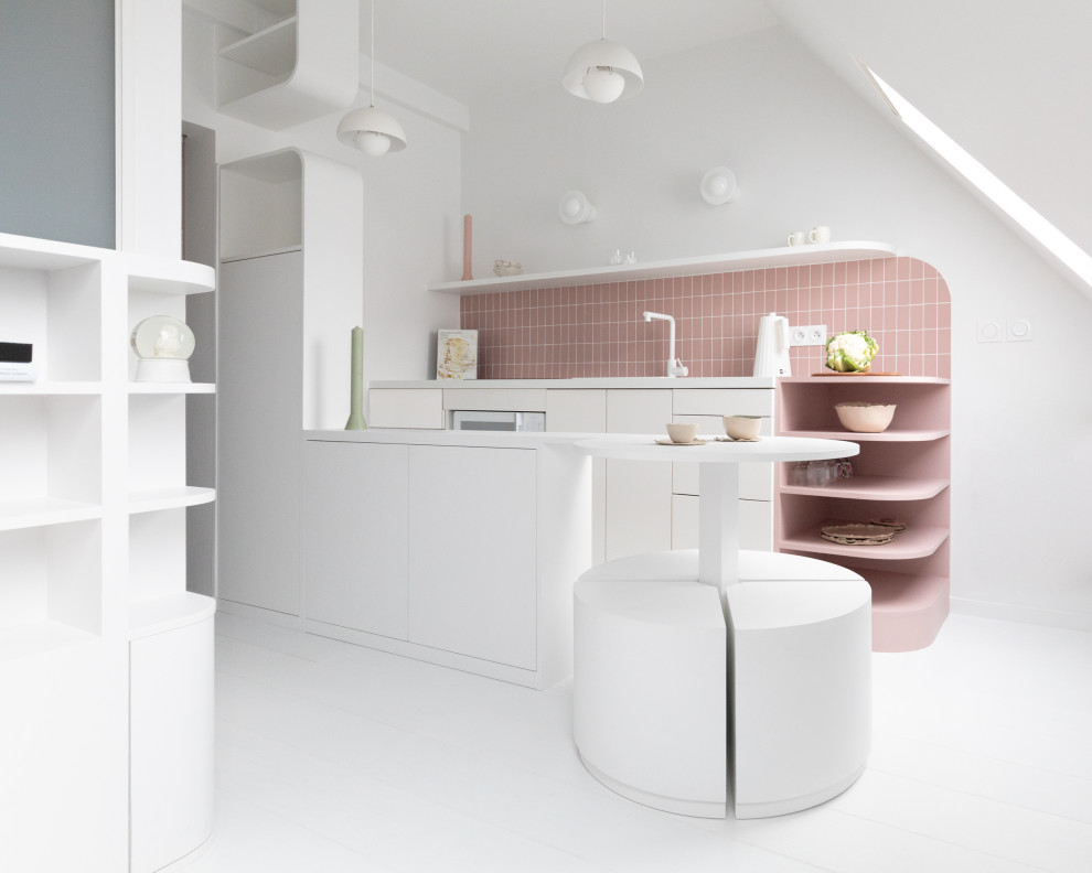 Inspiration for a small traditional single-wall eat-in kitchen in Paris with a single-bowl sink, beaded inset cabinets, white cabinets, laminate benchtops, pink splashback, ceramic splashback, white appliances, painted wood floors, with island, white floor and white benchtop.