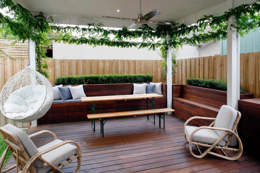 This is an example of a mid-sized country backyard verandah in Perth with a vertical garden, decking and a roof extension.