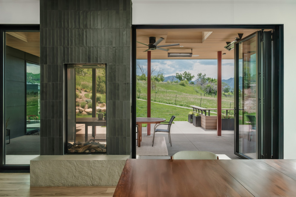 Example of a trendy dining room design in Denver