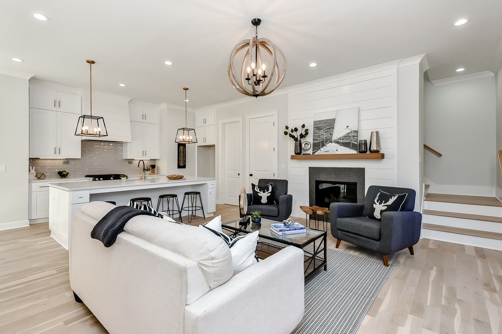 Mid-sized cottage open concept light wood floor and beige floor living room photo in Atlanta with gray walls, a standard fireplace, a tile fireplace and no tv