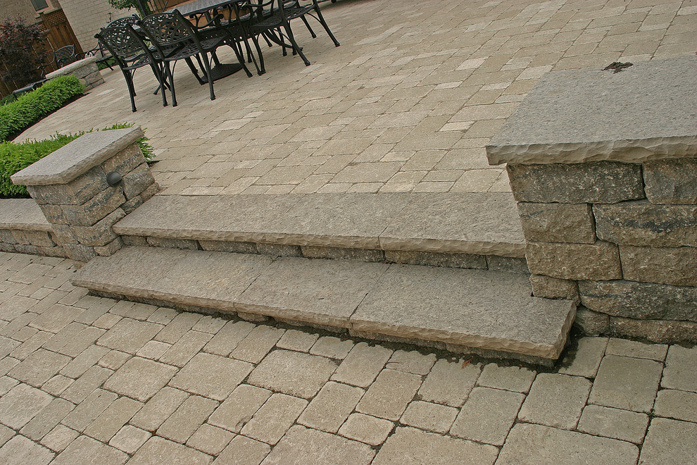 Example of a mid-sized transitional backyard concrete paver and kidney-shaped lap pool house design in Toronto with a gazebo