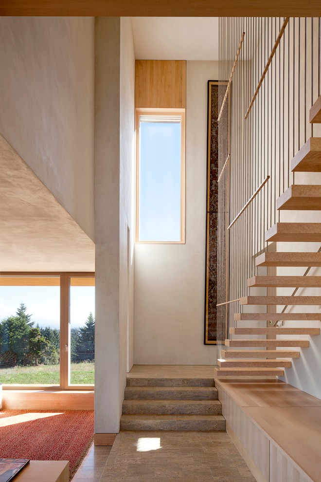 Contemporary wood straight staircase in Portland with open risers.