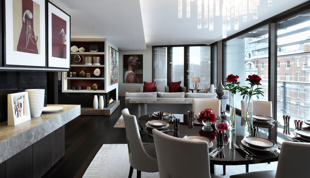 Inspiration for a contemporary open plan dining in London with dark hardwood floors.