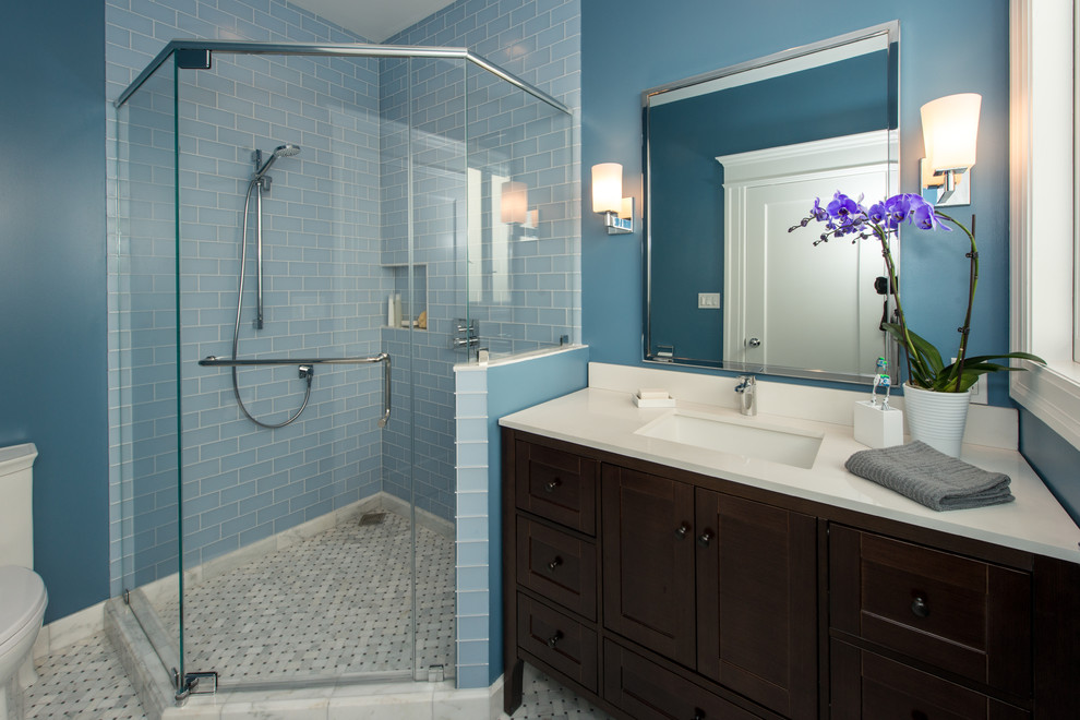 Mid-sized contemporary 3/4 bathroom in San Francisco with furniture-like cabinets, dark wood cabinets, a corner shower, blue tile, glass tile, blue walls, mosaic tile floors, an undermount sink, grey floor, a hinged shower door, white benchtops, a laundry, a shower seat, a single vanity and a built-in vanity.