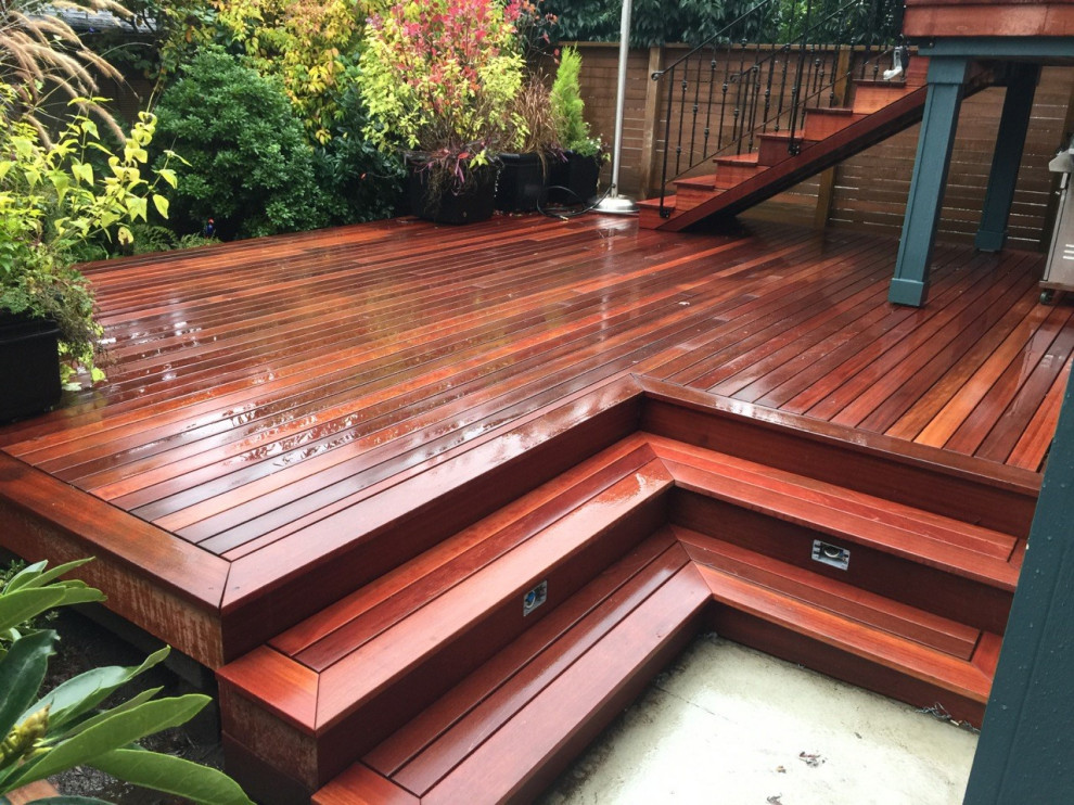 Inspiration for a mid-sized transitional backyard deck remodel in Calgary with no cover