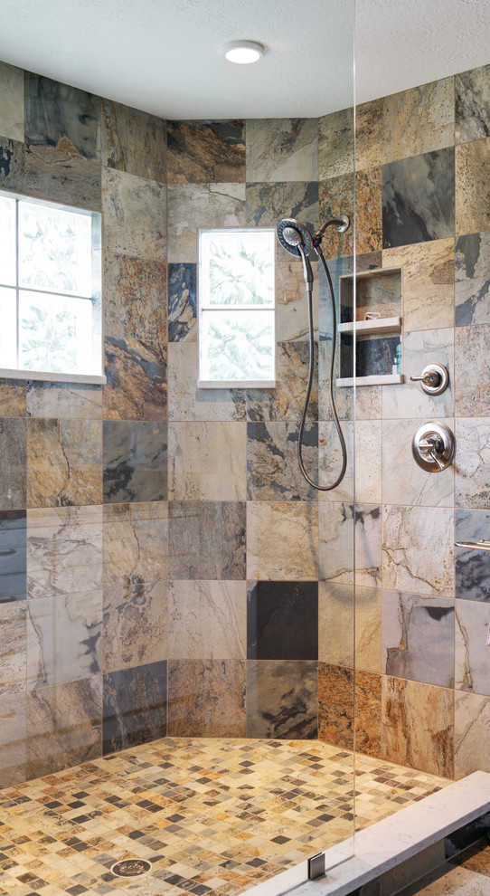 This is an example of an eclectic bathroom in Tampa with brown tile, multi-coloured tile and stone tile.