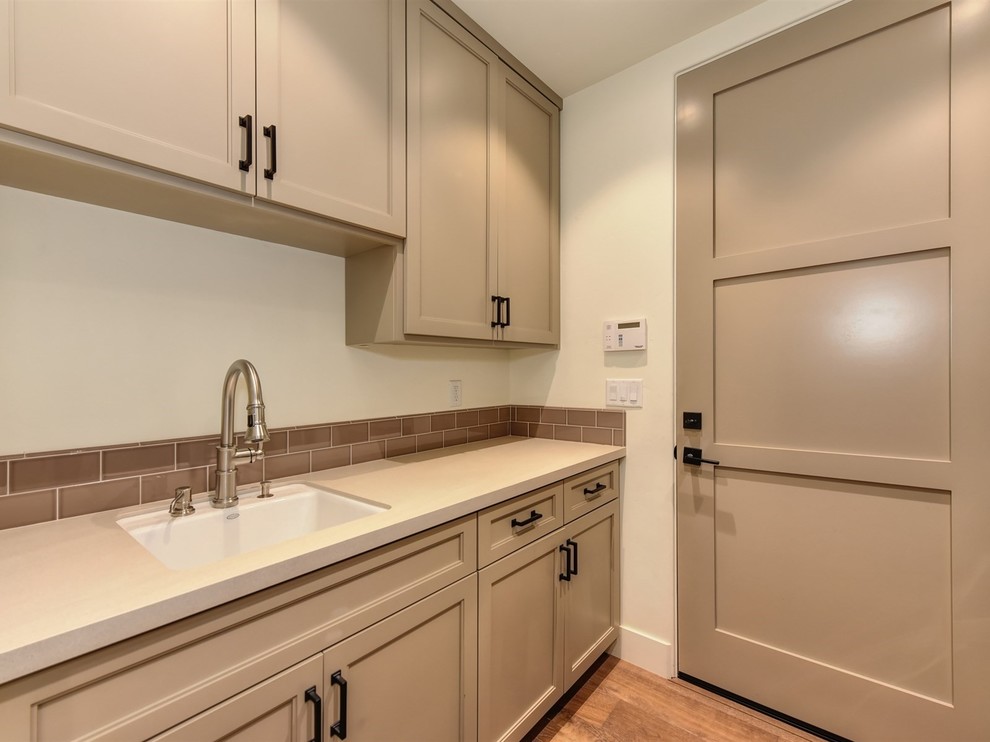 Transitional laundry room in Sacramento.