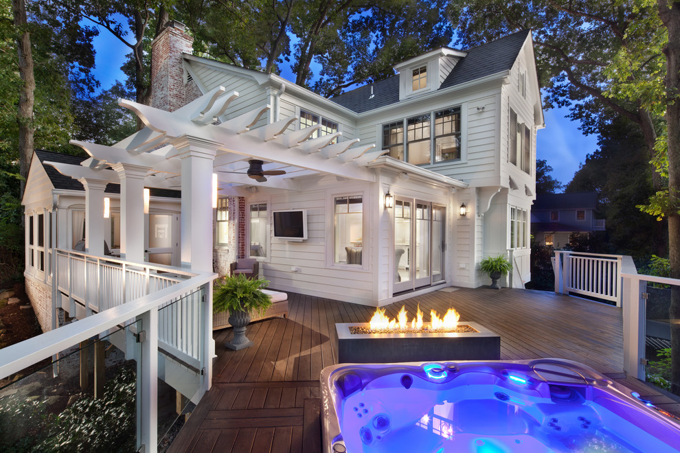 This is an example of a large traditional backyard deck in DC Metro with a pergola.