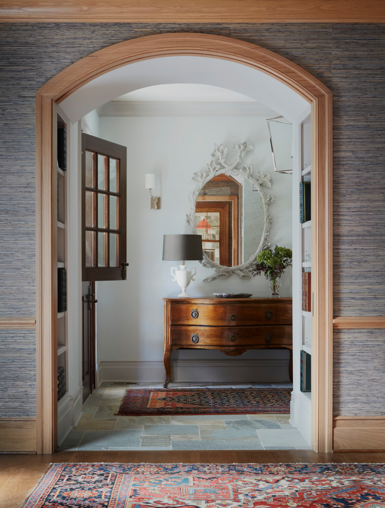 Traditional foyer in Other with white walls, slate flooring, a stable front door, a dark wood front door, multi-coloured floors, wallpapered walls and a dado rail.