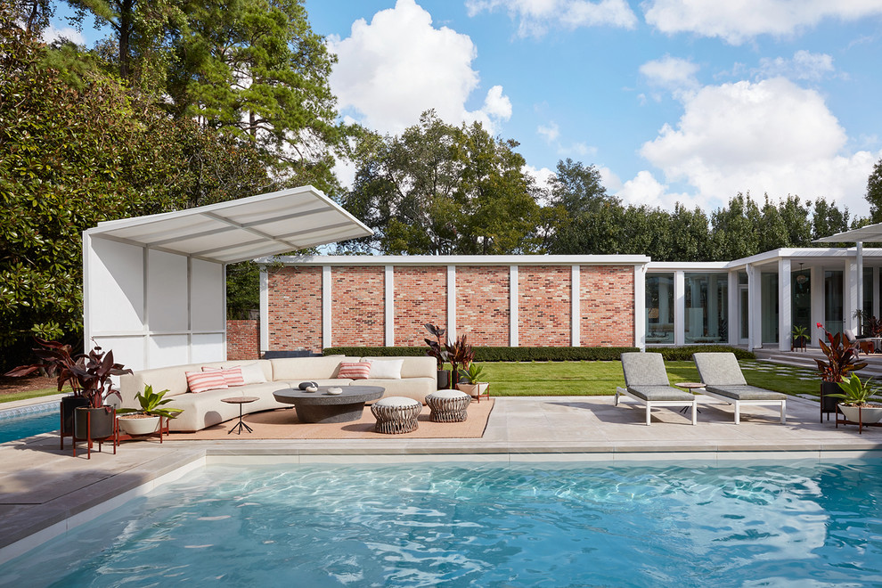 This is an example of a midcentury rectangular pool in Houston.