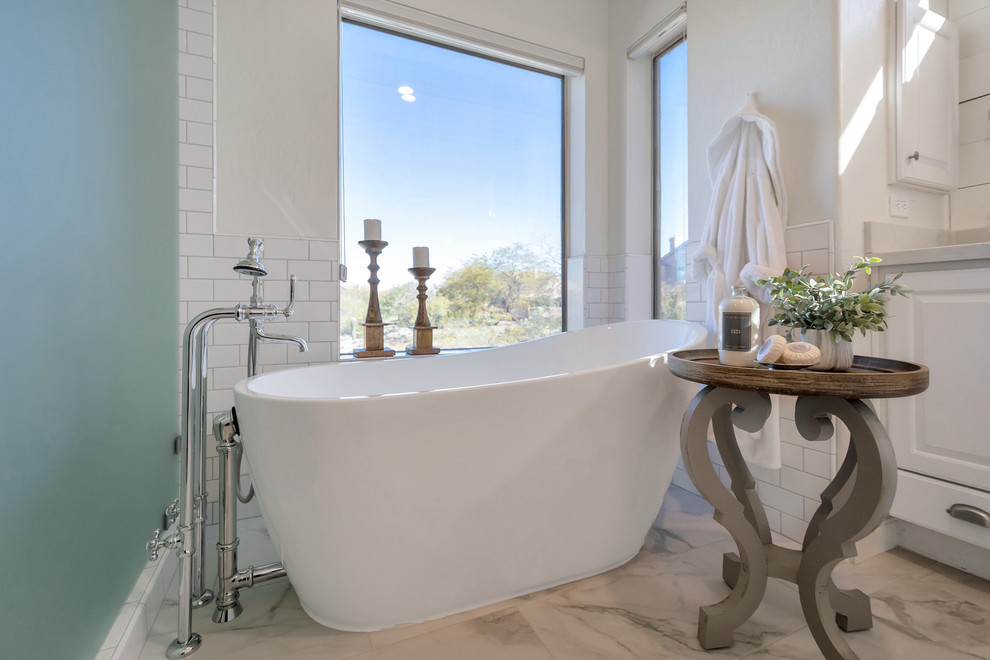 Freestanding bathtub - mid-sized transitional master white tile and subway tile porcelain tile and white floor freestanding bathtub idea in Phoenix with a hinged shower door