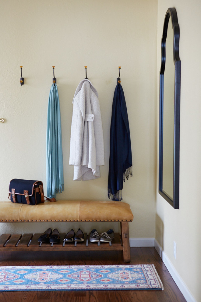 Example of a classic dark wood floor entryway design in San Francisco with beige walls
