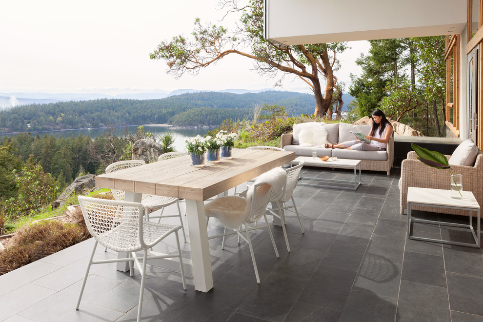 Inspiration for a contemporary patio in Vancouver with tiled flooring.