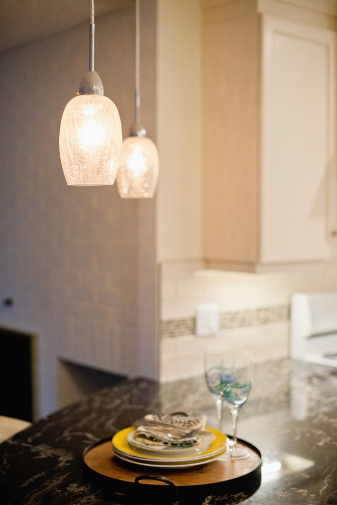 Mid-sized transitional ceramic tile eat-in kitchen photo in Ottawa with granite countertops, ceramic backsplash and an island