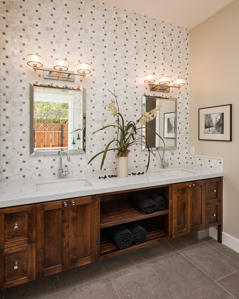 Example of a transitional master white tile and mosaic tile ceramic tile bathroom design with shaker cabinets, dark wood cabinets, beige walls, an undermount sink and marble countertops