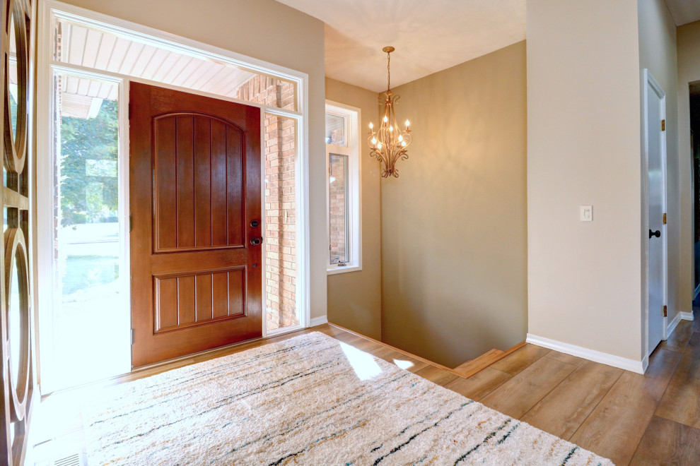 Single front door - transitional vinyl floor single front door idea with gray walls and a brown front door