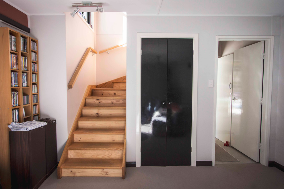 Photo of a mid-sized transitional living room in Sydney with white walls.