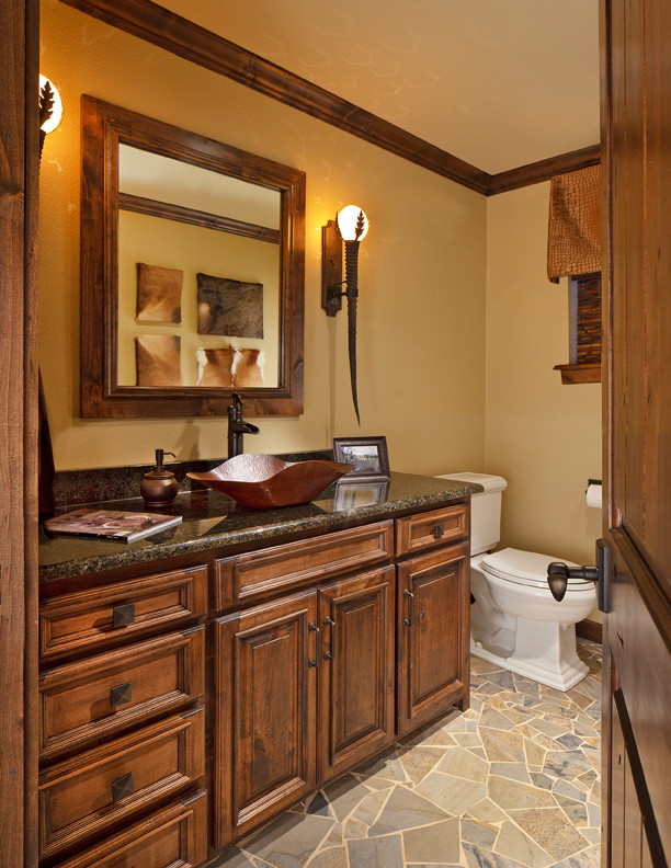 Traditional bathroom in Dallas with a vessel sink, flat-panel cabinets, dark wood cabinets, granite benchtops, a one-piece toilet, multi-coloured tile and porcelain tile.