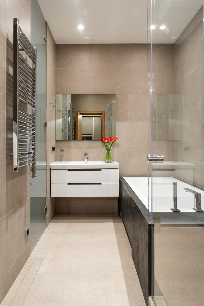 Inspiration for a mid-sized contemporary master bathroom in Other with flat-panel cabinets, white cabinets, a corner shower, beige tile and a drop-in tub.