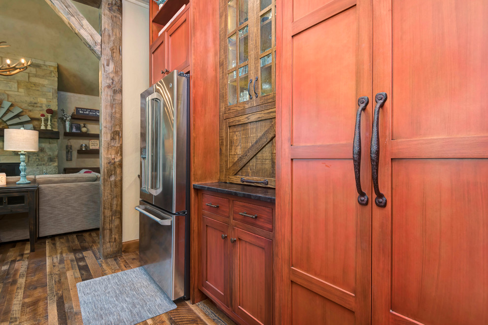 Inspiration for a large rustic kitchen remodel with shaker cabinets, medium tone wood cabinets and an island