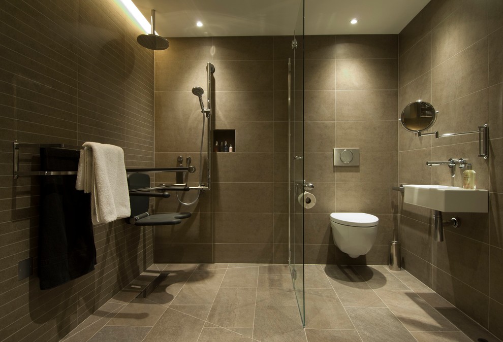 Inspiration for a small contemporary 3/4 bathroom in London with an open shower, a wall-mount toilet, beige tile, porcelain tile and ceramic floors.