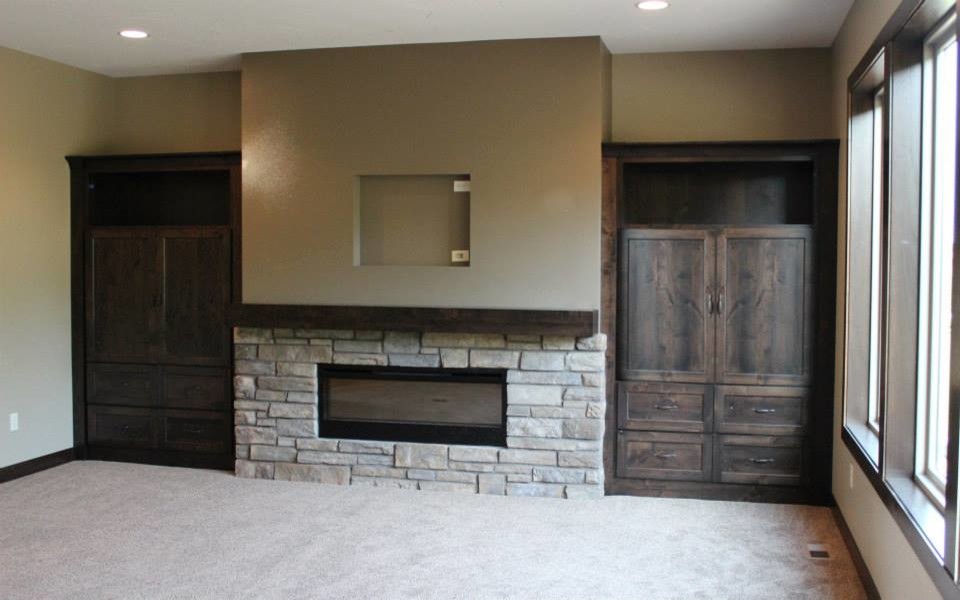 Photo of a mid-sized transitional open concept living room in Other with beige walls, carpet, a ribbon fireplace and a stone fireplace surround.