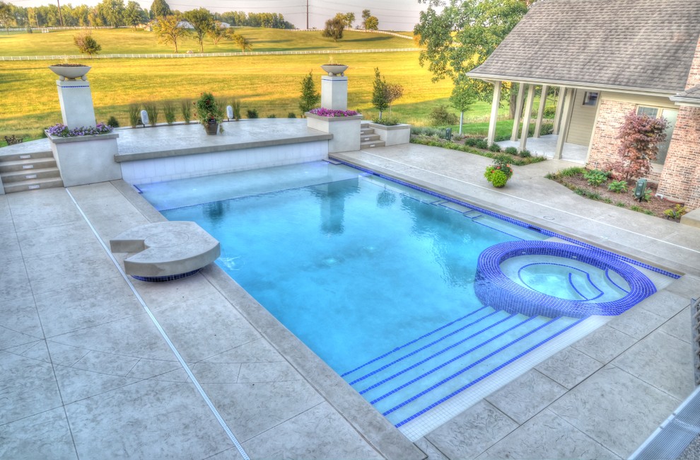 Hot tub - large transitional backyard concrete paver and rectangular natural hot tub idea in Cedar Rapids
