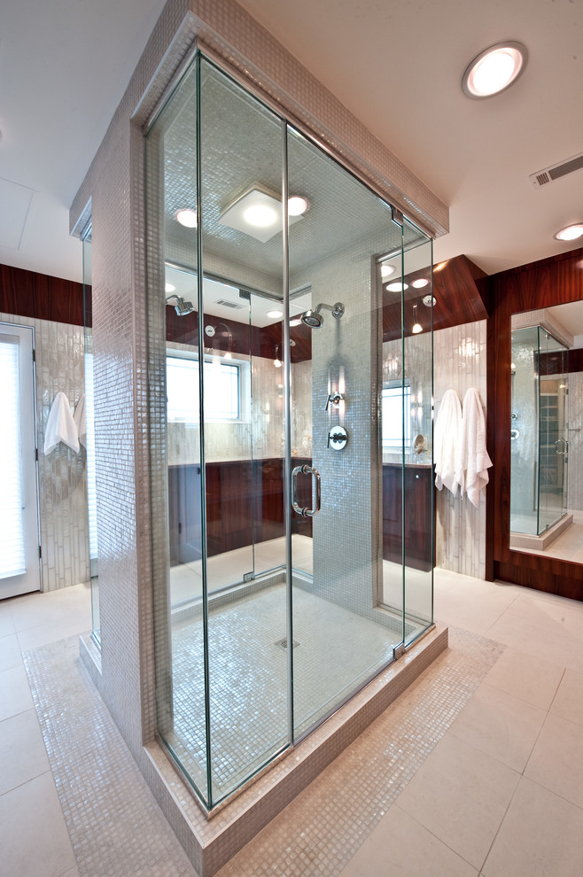 Inspiration for a mid-sized contemporary master bathroom in DC Metro with shaker cabinets, dark wood cabinets, an open shower, a wall-mount toilet, white tile, brown walls, mosaic tile floors, an undermount sink, marble benchtops, beige floor and a hinged shower door.