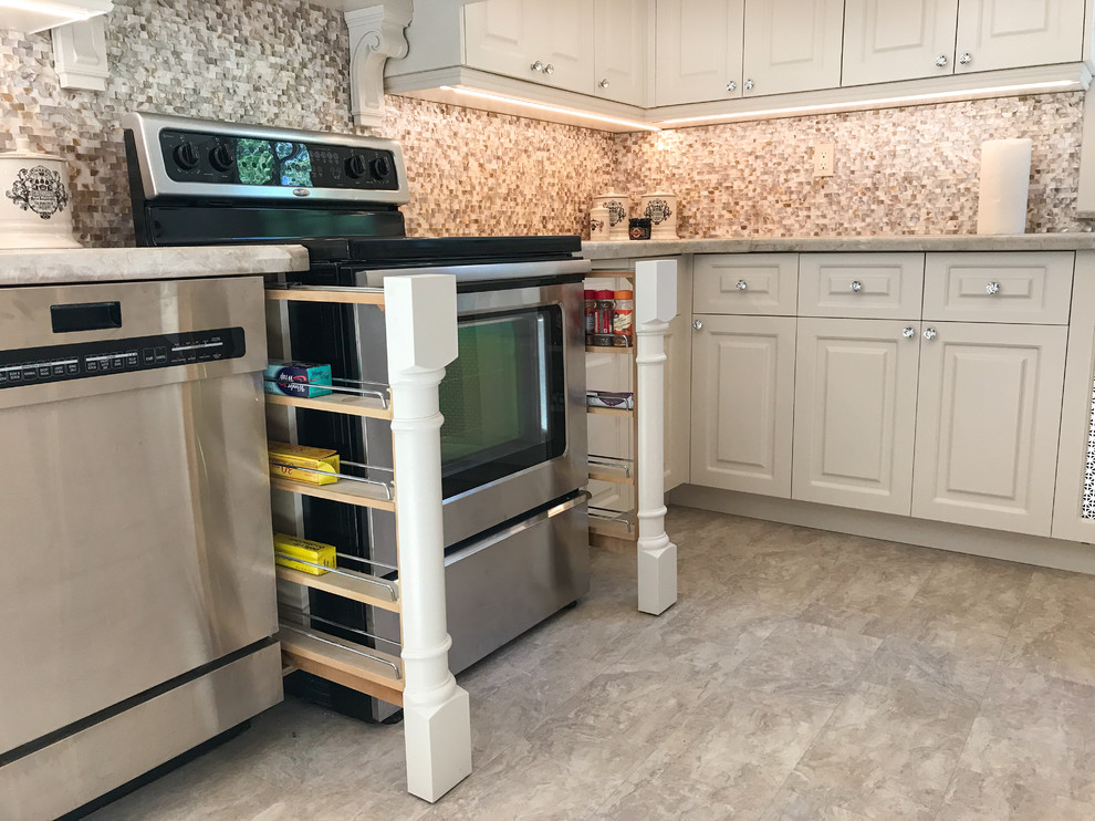 This is an example of a large transitional u-shaped eat-in kitchen in Toronto with an undermount sink, raised-panel cabinets, beige cabinets, quartzite benchtops, beige splashback, mosaic tile splashback, white appliances, linoleum floors, no island, beige floor and beige benchtop.
