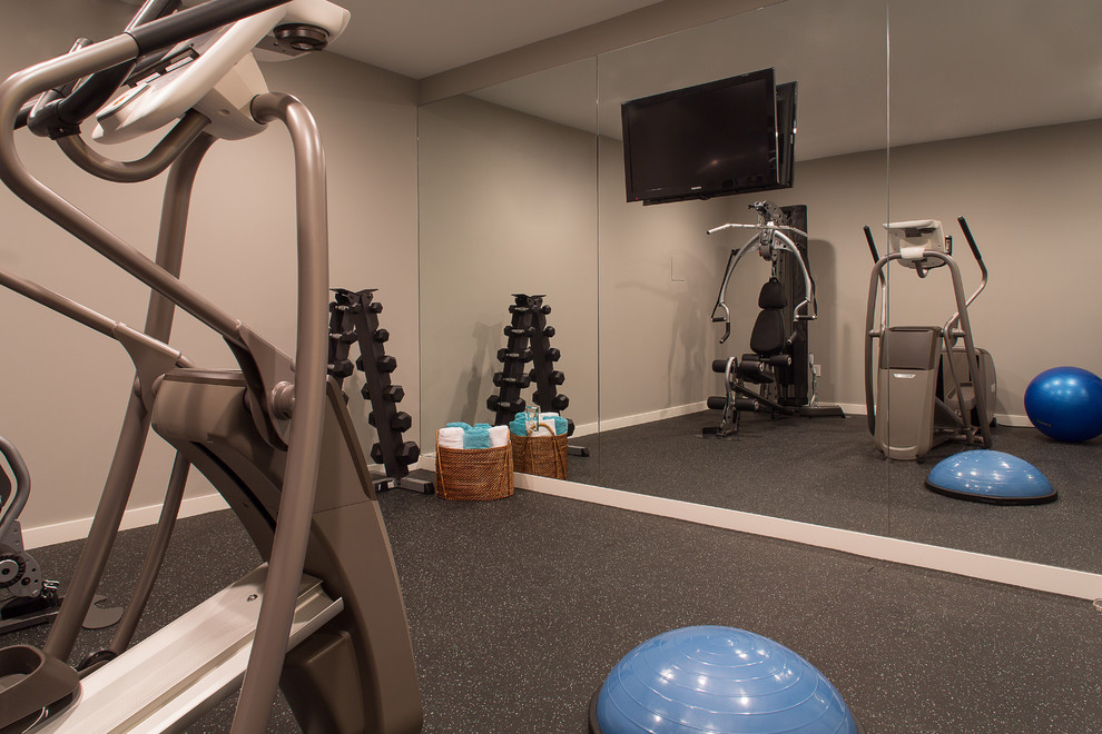 Photo of a contemporary home gym in New York with grey floor.