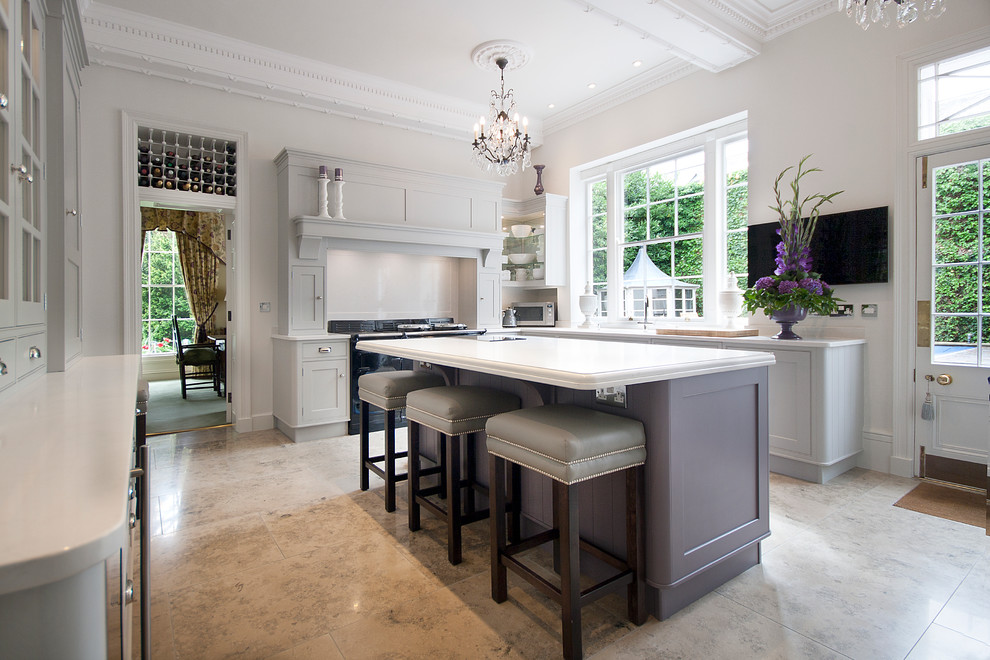 Photo of a large traditional u-shaped separate kitchen in Other with an undermount sink, shaker cabinets, grey cabinets, quartzite benchtops, white splashback, black appliances, with island and marble floors.