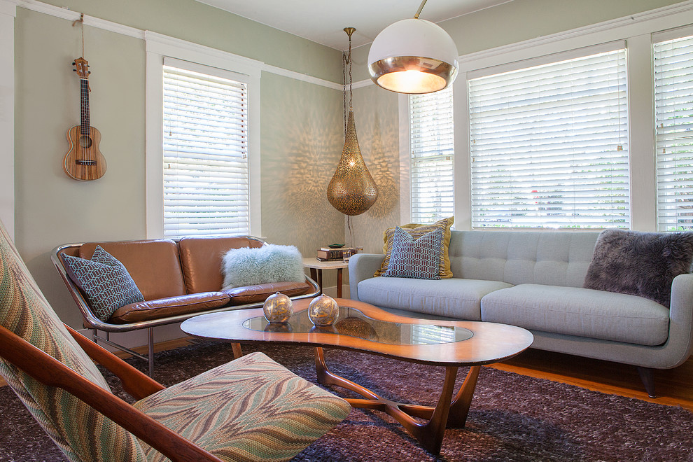 Small mid-century modern formal and open concept medium tone wood floor living room photo in San Francisco with green walls and no fireplace