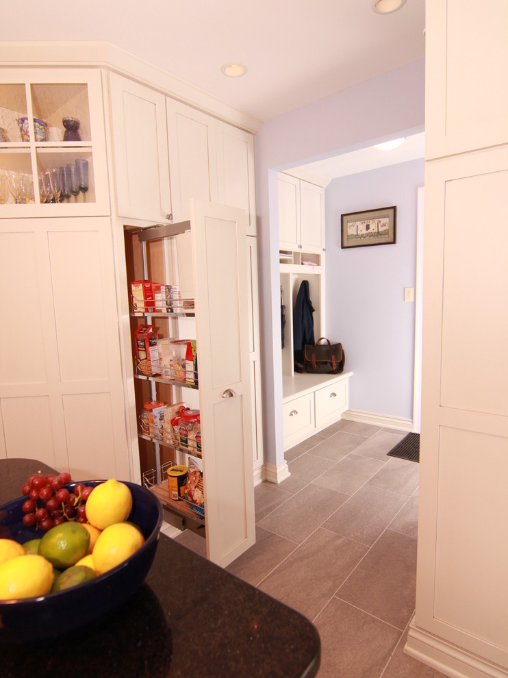 This is an example of a mid-sized transitional hallway in Philadelphia with blue walls.