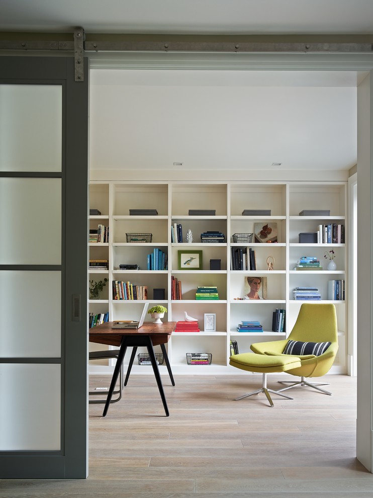 Design ideas for a contemporary study room in San Francisco with light hardwood floors and a freestanding desk.